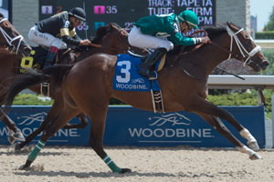 Gary Boulanger guides Lokinforpursemonee to victory in the $125,000 Victoria Stakes. Photo by Michael Burns Photography