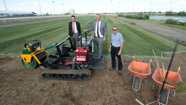 Jonathan Zammit, Vice President of Thoroughbred Racing Operations, Jim Lawson, President and CEO of Woodbine Entertainment, and Irwin Driedger, Director of Thoroughbred Racing Surfaces & Fleet, gathered on the new inner turf course after the first section of sod was installed on Wednesday, June 13 at Woodbine. Michael Burns Photo