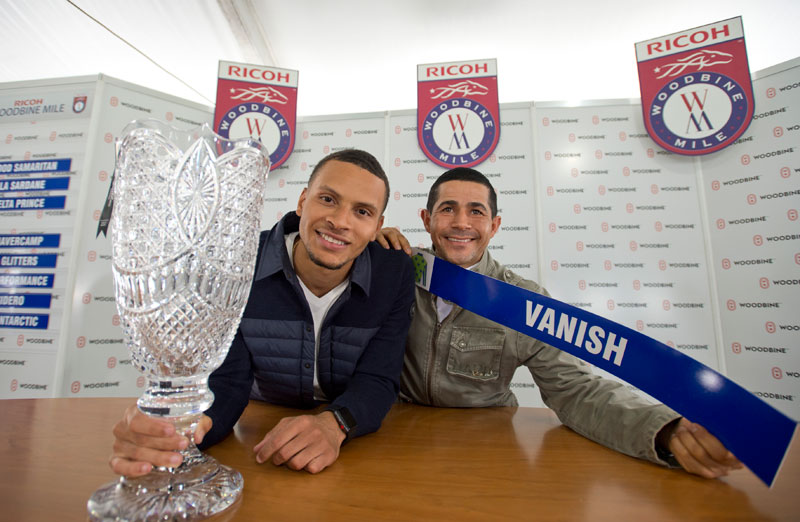 Three-time Olympic sprint medalist Andre De Grasse and jockey Ademar Santos at the Ricoh Woodbine Mile post position draw on Wednesday, Sept. 12 at Woodbine Racetrack. Michael Burns Photo