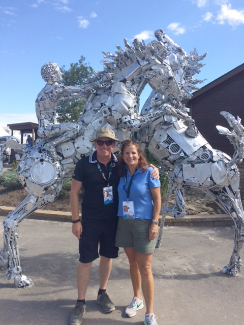 Pamela and Jon Garner, Canada's chef de mission, in front of Fighting Stallions.