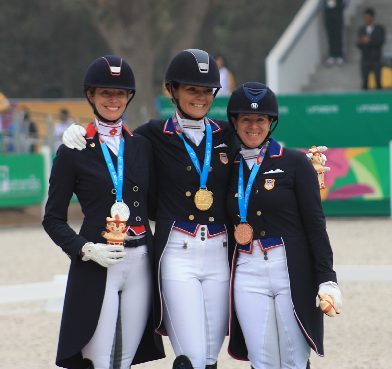 Individual dressage medals went to (l-r) Tina Irwin (CAN, silver); Sarah Lockman (USA, gold); and Jennifer Baumert (USA, bronze).