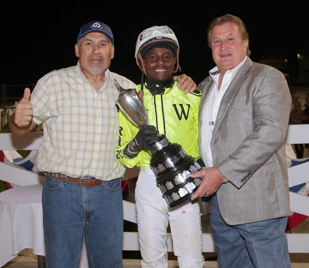 Antonito Whitehall, Jerry Gourneau and Henry S. Witt Jr in the winners circle.